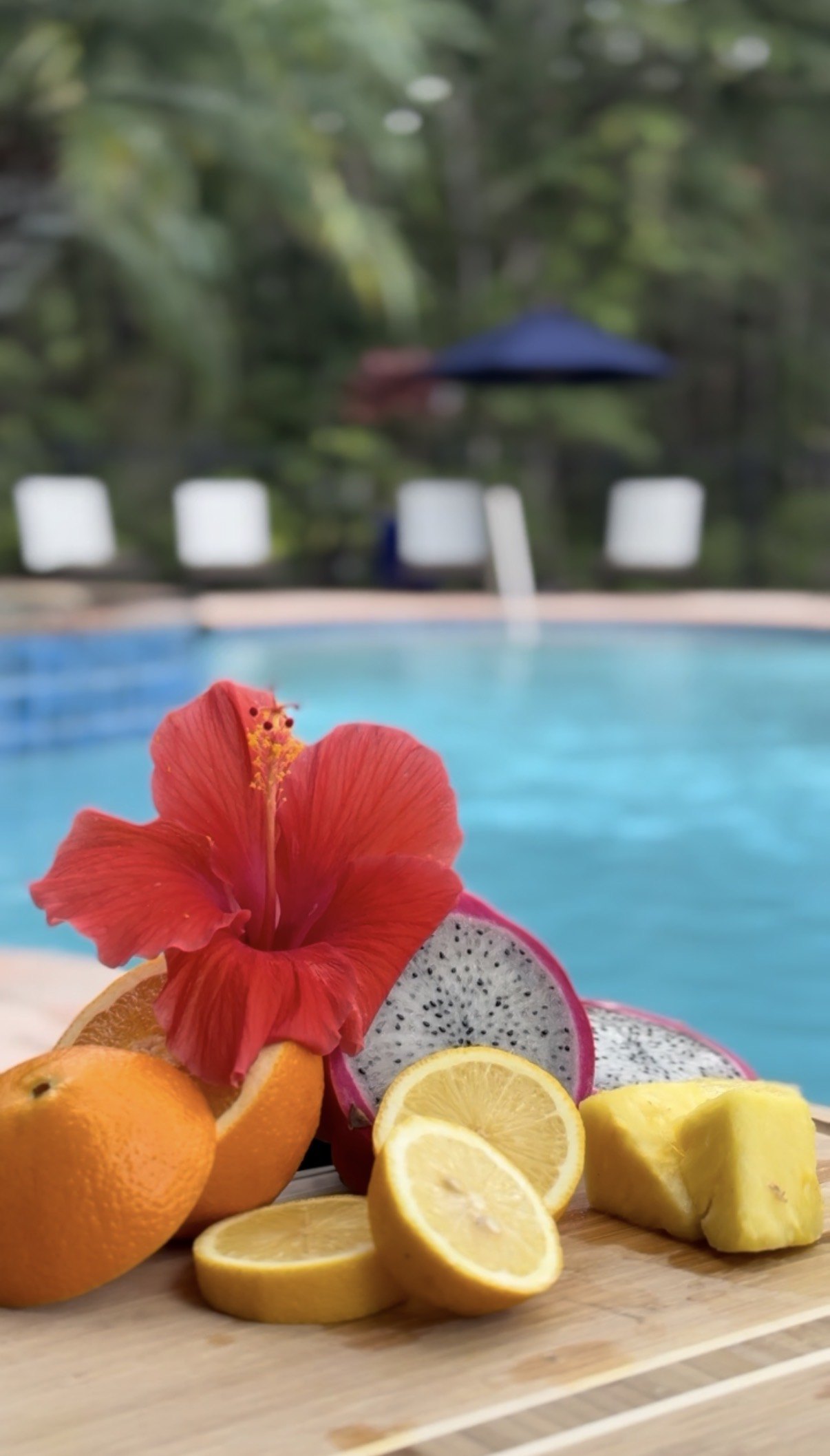 Fresh tropical fruit arranged beside a pool in Florida.